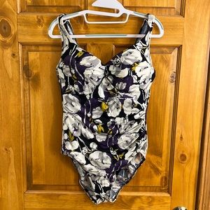 Miraclesuit 1 piece swimsuit in a beautiful purple floral pattern.  Size 14.